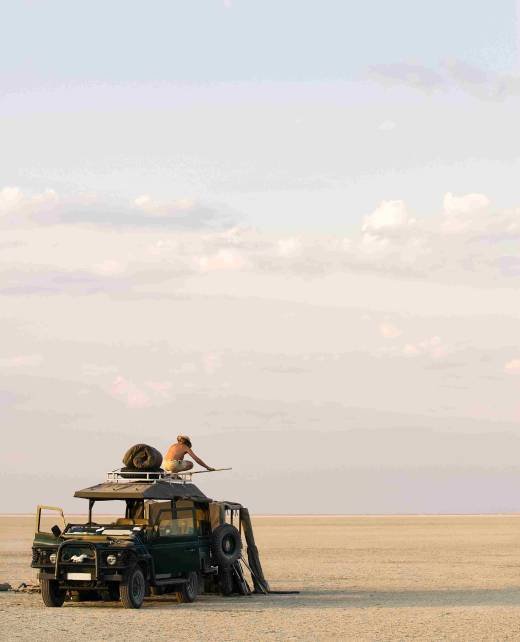 man-standing-on-top-of-4x4-parked-on-the-makadikad-2026-01-09-10-10-34-utc_11zon